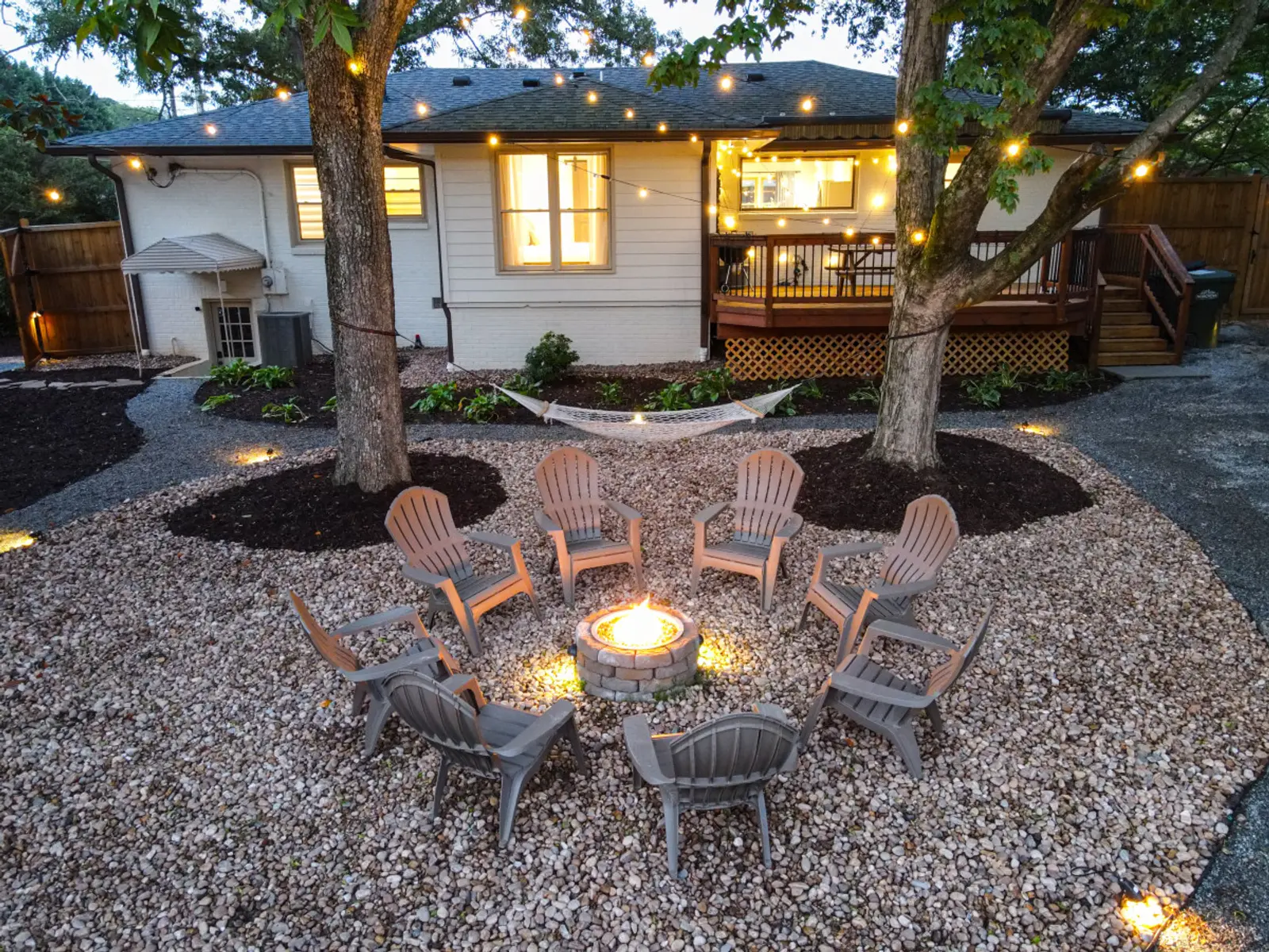 Evening view across the fire pit toward the Crossing House deck