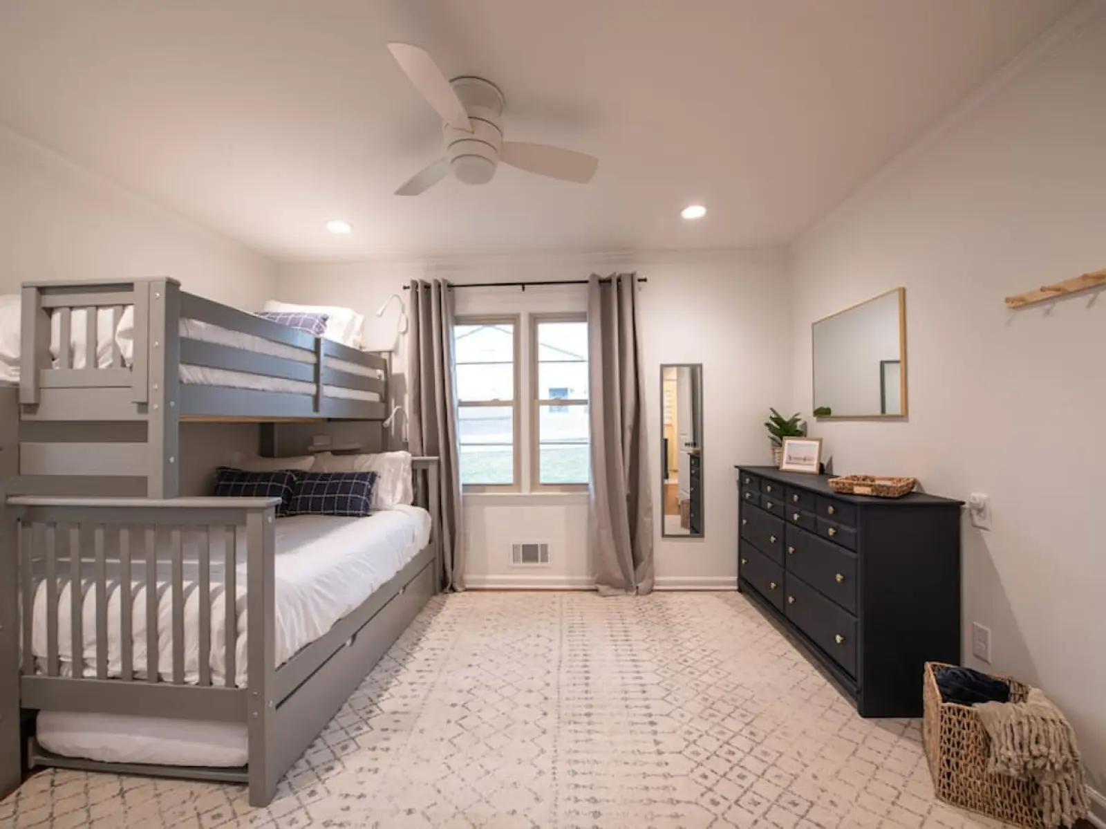Bedroom with a bunk bed, trundle and dresser